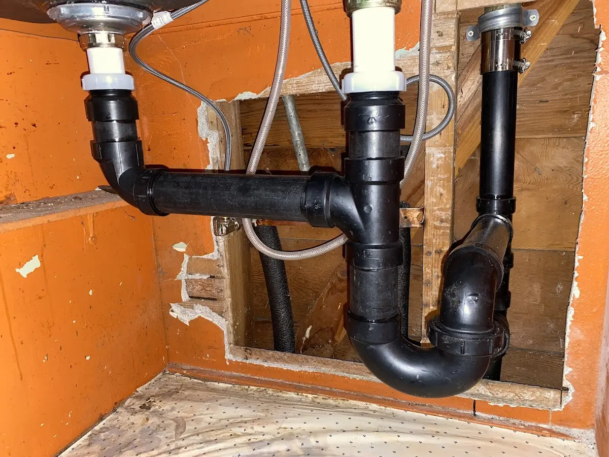 Professional Garbage Disposal Repair equipment and tools on the job in Grayling